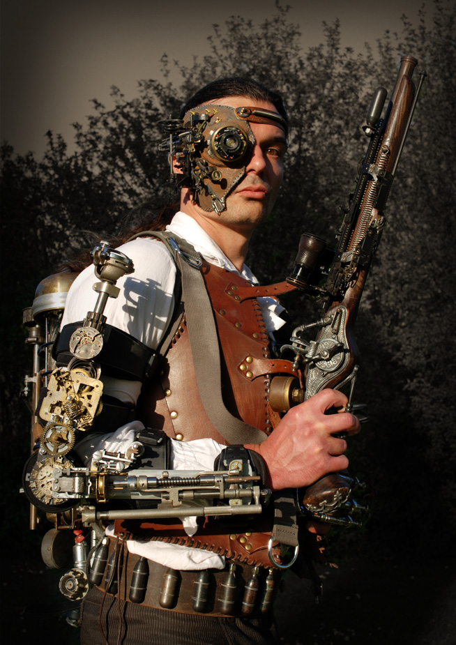 what is Steampunk:steampunk-outfit-with-leather-vest-heavy-gun-vambrace-backpack-time-machine-mask-and-victorian-clothes